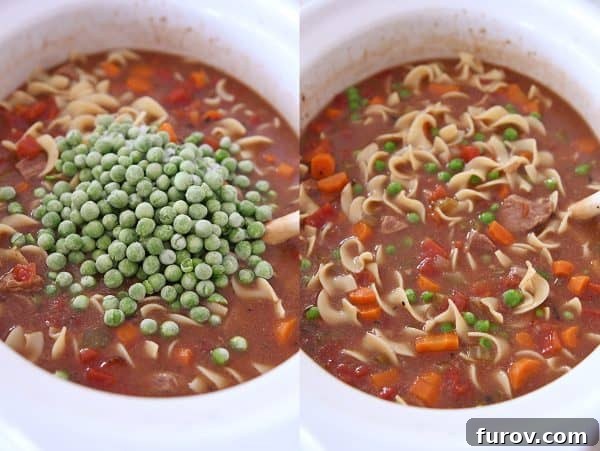 Adding frozen peas to slow cooker beef vegetable noodle soup.