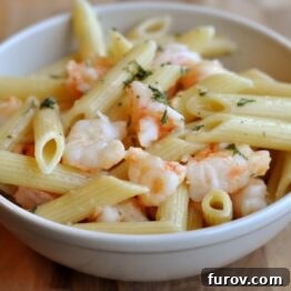Close-up of butter garlic shrimp penne in a bowl.