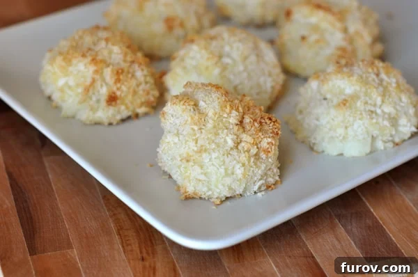 Homemade Baked Potato Puffs 2 A rectangular white platter filled with small, golden homemade potato puffs, perfectly baked and crispy.
