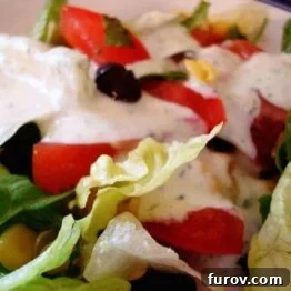 Creamy Cilantro Lime Vinaigrette 3 A vibrant green creamy cilantro lime dressing in a glass jar, ready for serving over salads or as a dip.