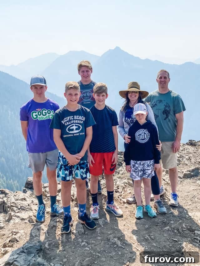 Friday Musings 10 A family stands together at the edge of a breathtaking mountain overlook, embodying unity and perspective amidst life's vastness.