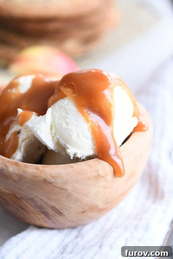From Scratch Golden Caramel Bliss 14 Vanilla ice cream generously drizzled with rich homemade caramel sauce, a classic dessert.
