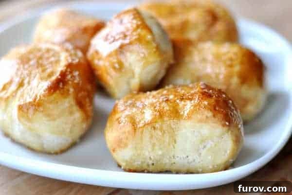 Irresistible Homemade Pretzel Bites 19 Chewy Pretzel Bites on a white plate.