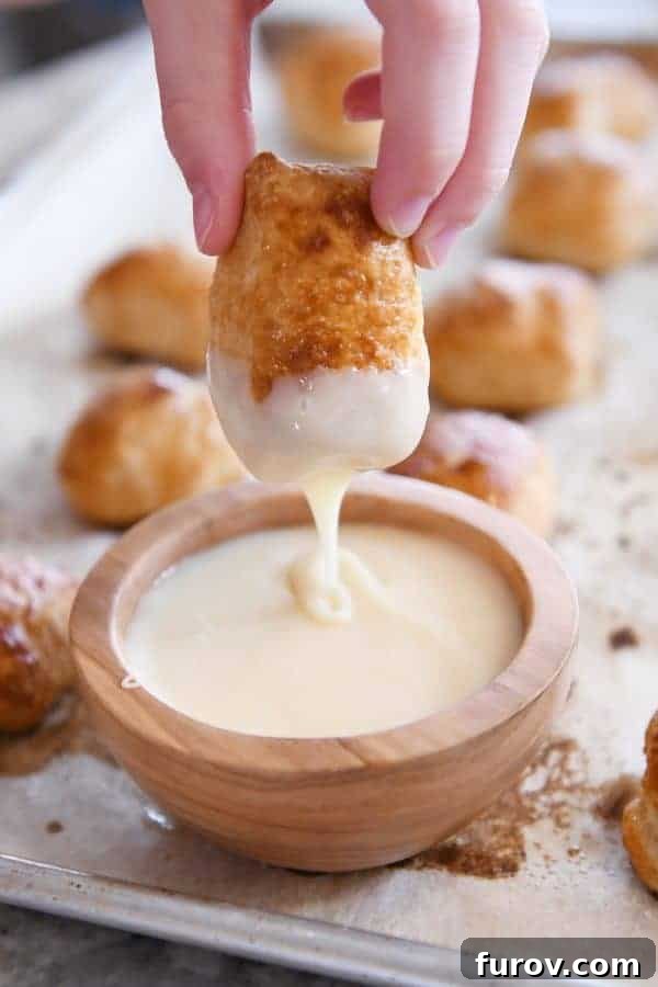 Irresistible Homemade Pretzel Bites 4 Dipping easy homemade soft pretzel bites in homemade cheese sauce.