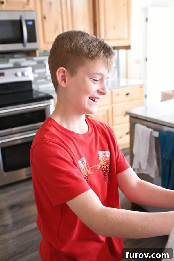 Irresistible Homemade Pretzel Bites 5 12-year old helping make pretzel bites.