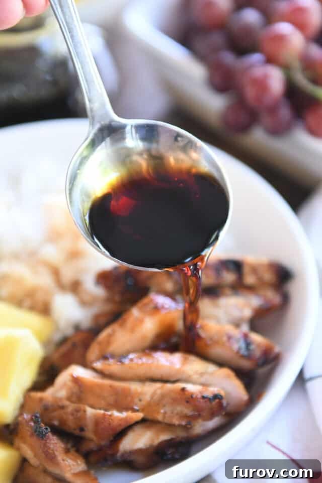 Grilled Chicken with Our Signature Teriyaki Glaze 8 Drizzling teriyaki sauce over slices of chicken in white bowl.