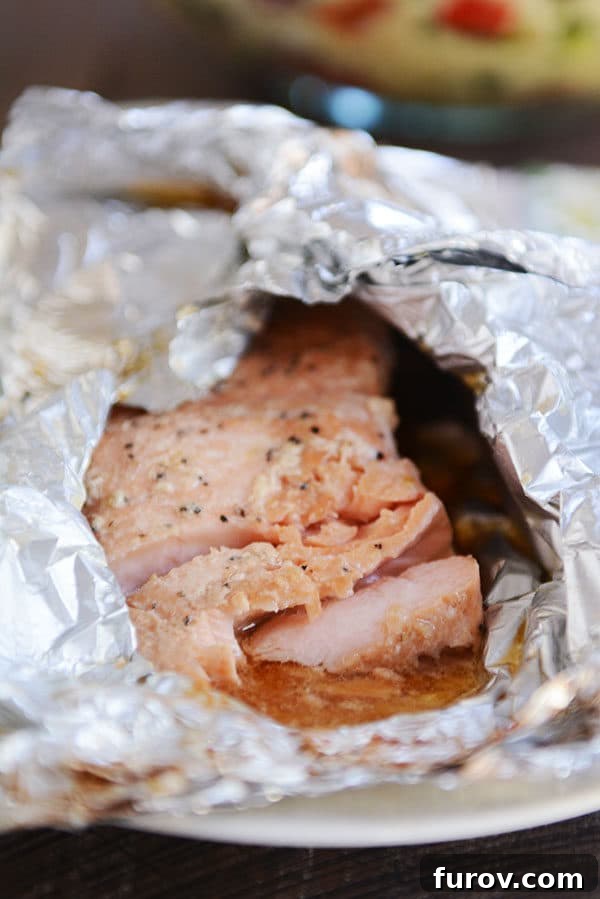 Succulent Grilled Salmon 4 A partially unwrapped tinfoil packet of grilled salmon.