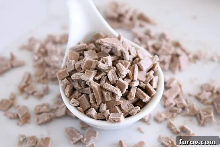 White bowl with chopped cinnamon bits for baking.