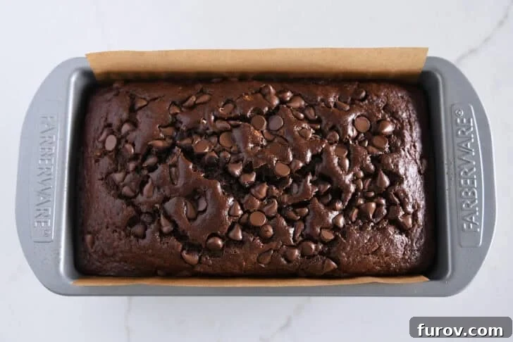 Chocolate Banana Bread with Sour Cream for Moist Loaves 3 Top down view of baked loaf of chocolate banana bread.