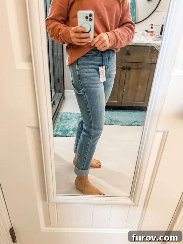 Friday Favorites: Updates, Finds, and Weekend Reflections 3 Woman in mirror with jeans and sweatshirt.