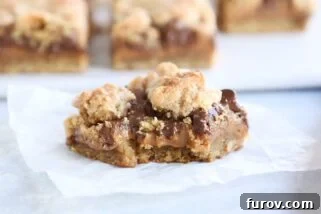 bite taken out of caramel peanut butter caramel bar