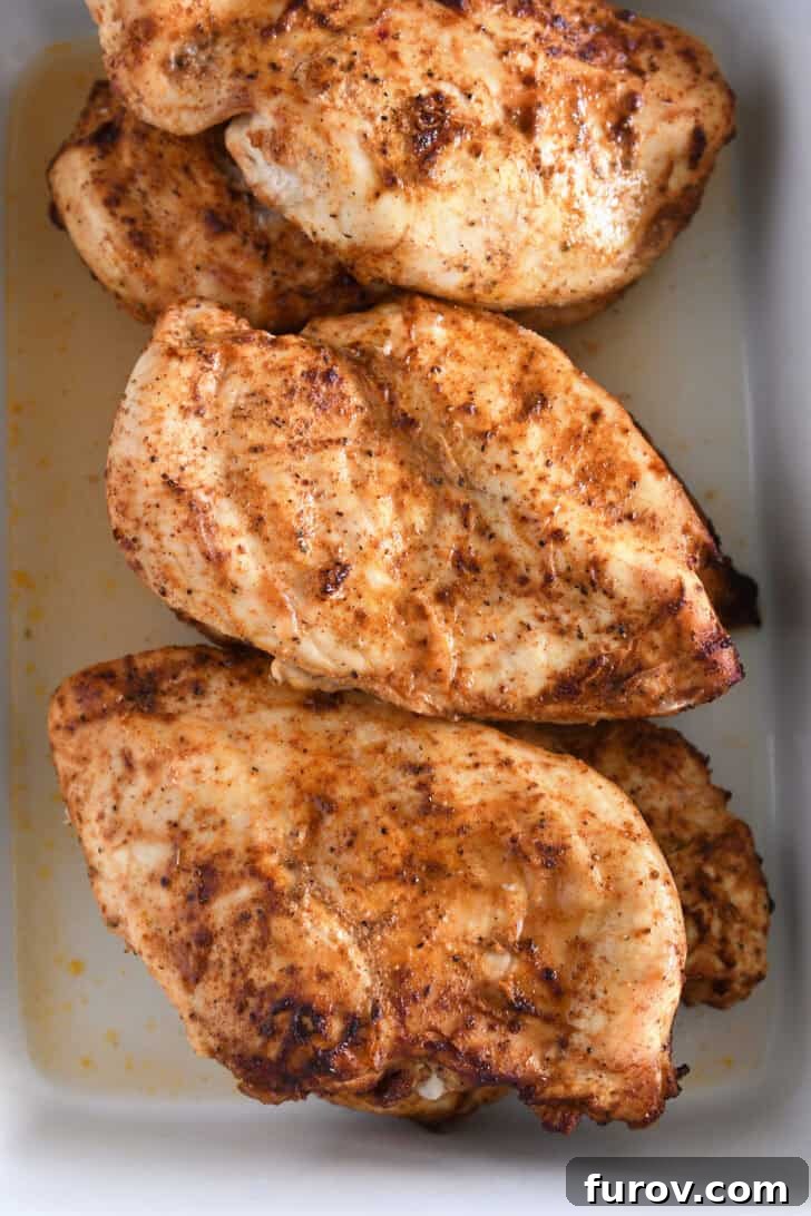 Sizzling Chicken Fajitas with Peppers and Onions 4 Cooked chicken breasts covered in fajita seasoning.