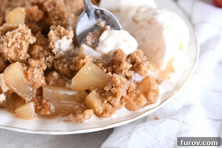 Apple crisp served with ice cream