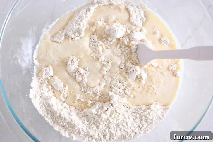 Fluffy Cinnamon Roll Bites Recipe: Soft, Bite-Sized Treats 3 Glass bowl with flour and butter and hot water.