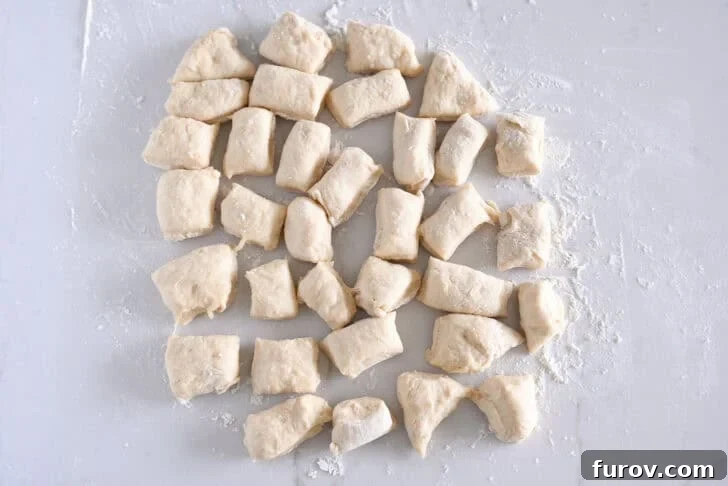Fluffy Cinnamon Roll Bites Recipe: Soft, Bite-Sized Treats 5 34 pieces of dough on lightly floured counter.